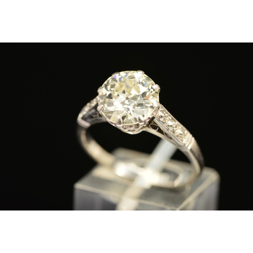 15 - A MID 20TH CENTURY LARGE DIAMOND SINGLE STONE RING, a transitional brilliant cut diamond measuring 9... 