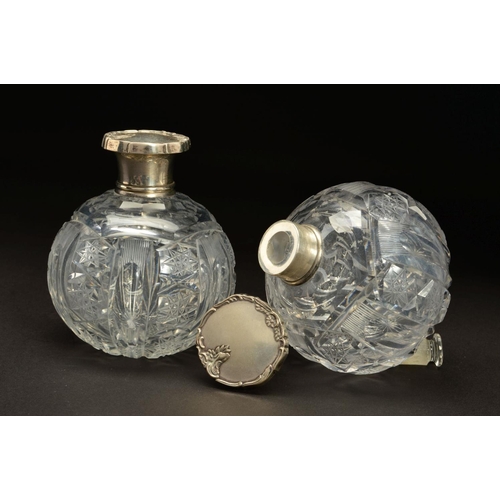 153 - A PAIR OF EARLY 20TH CENTURY SPHERICAL GLASS SCENT BOTTLES, with white metal pull off covers stamped... 