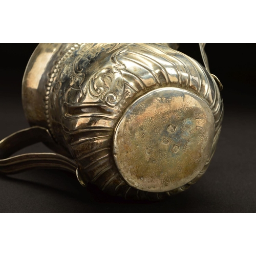 154 - A GEORGE III SILVER LOVING CUP, with a ribbed girdle and punched bands of leaves, chased with a foli... 