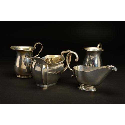 166 - A PAIR OF GEORGE VI SILVER BALUSTER CREAM JUGS, 'S' scroll handles, makers James Dixon & Sons Ltd, S... 