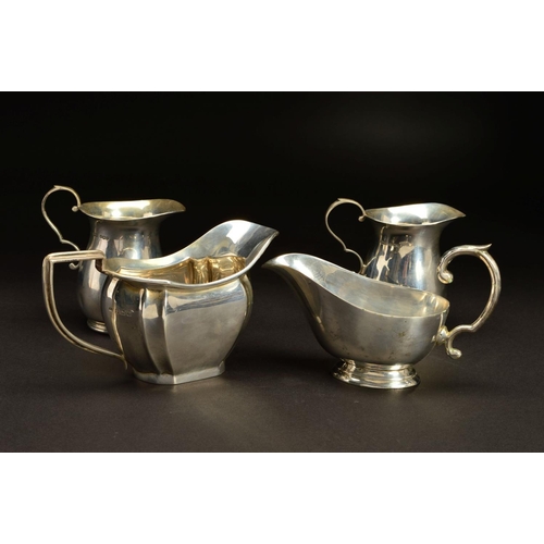 166 - A PAIR OF GEORGE VI SILVER BALUSTER CREAM JUGS, 'S' scroll handles, makers James Dixon & Sons Ltd, S... 