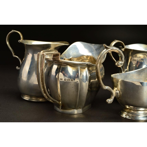 166 - A PAIR OF GEORGE VI SILVER BALUSTER CREAM JUGS, 'S' scroll handles, makers James Dixon & Sons Ltd, S... 