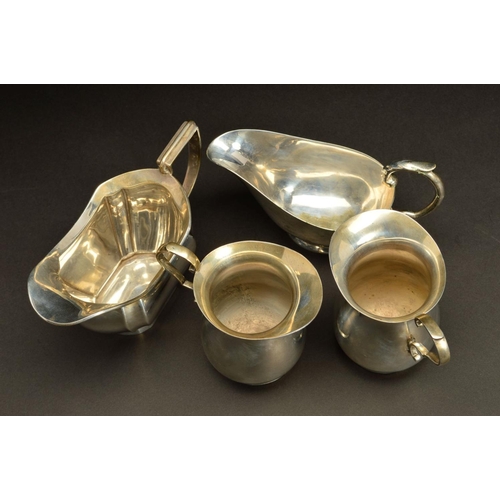 166 - A PAIR OF GEORGE VI SILVER BALUSTER CREAM JUGS, 'S' scroll handles, makers James Dixon & Sons Ltd, S... 