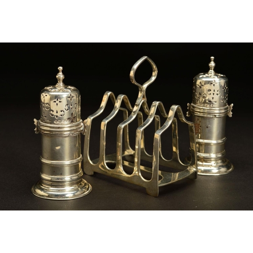 180 - A PAIR OF VICTORIAN SILVER PEPPERETTES, of lighthouse shape, knopped finials, bayonet fitting covers... 