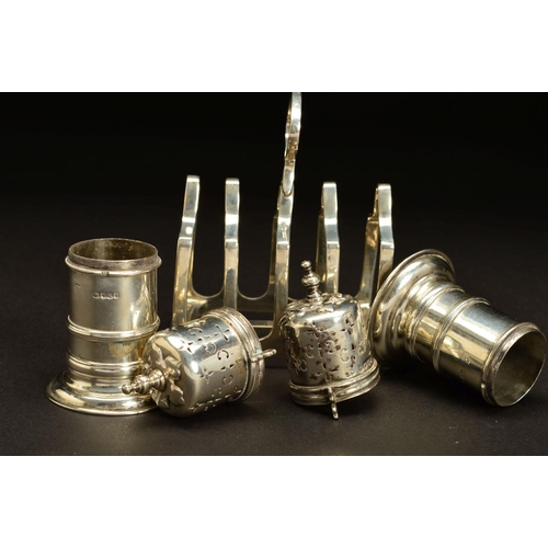 180 - A PAIR OF VICTORIAN SILVER PEPPERETTES, of lighthouse shape, knopped finials, bayonet fitting covers... 