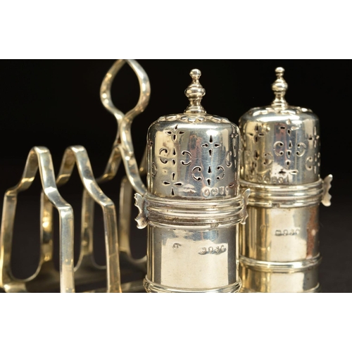 180 - A PAIR OF VICTORIAN SILVER PEPPERETTES, of lighthouse shape, knopped finials, bayonet fitting covers... 