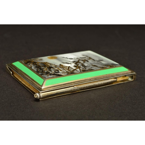 181 - A GEORGE V SILVER AND ENAMEL AIDE MEMOIRE, of rectangular form, the hinged cover enamelled with a Ja... 