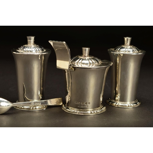 183 - AN ELIZABETH II SILVER FOUR PIECE CRUET SET BY ROBERT EDGAR STONE, of conical form, with domed cover... 