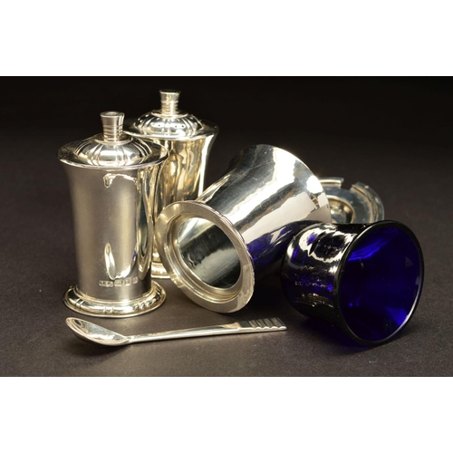 183 - AN ELIZABETH II SILVER FOUR PIECE CRUET SET BY ROBERT EDGAR STONE, of conical form, with domed cover... 