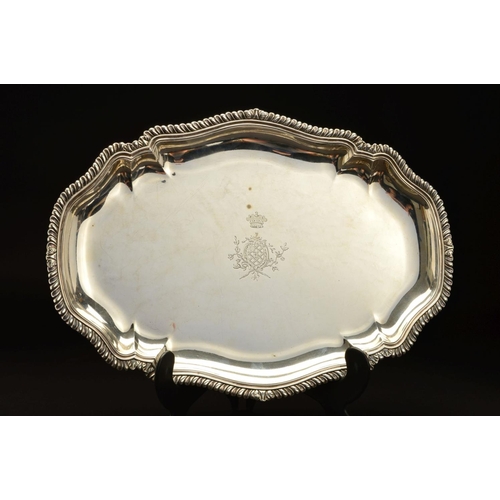 189 - A GEORGE II SILVER MEAT/SERVING PLATTER, of shaped oval form, gadrooned and stepped rim, the centre ... 