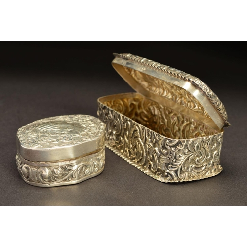 190 - A LATE 19TH CENTURY CONTINENTAL SILVER BOX, of shaped oval form, the hinged cover embossed with a si... 