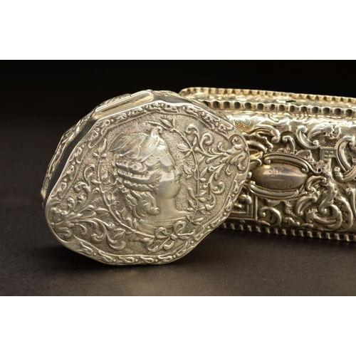 190 - A LATE 19TH CENTURY CONTINENTAL SILVER BOX, of shaped oval form, the hinged cover embossed with a si... 