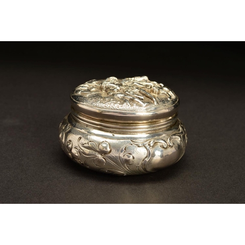 191 - A LATE 19TH CENTURY CONTINENTAL SILVER TRINKET BOX, of circular form, the hinged cover repousse deco... 