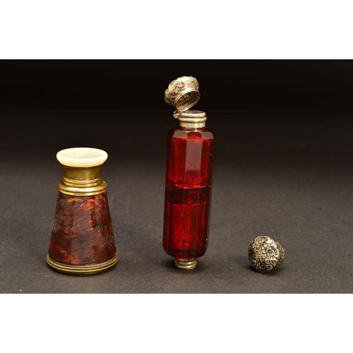 195 - A LATE VICTORIAN RUBY GLASS DOUBLE ENDED SCENT BOTTLE, of decagonal form, one end with hinged white ... 