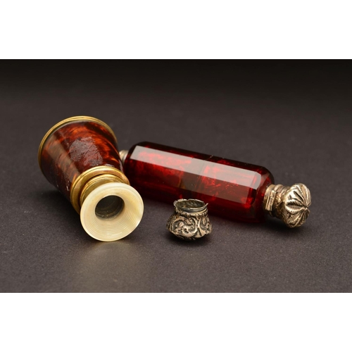 195 - A LATE VICTORIAN RUBY GLASS DOUBLE ENDED SCENT BOTTLE, of decagonal form, one end with hinged white ... 