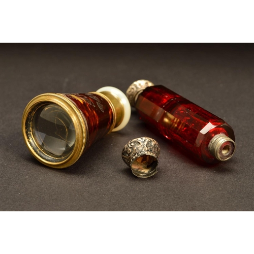 195 - A LATE VICTORIAN RUBY GLASS DOUBLE ENDED SCENT BOTTLE, of decagonal form, one end with hinged white ... 