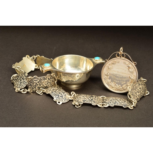 198 - A GEORGE V SILVER MINIATURE QUAICH, the handles inset with a turquoise cabochon, engraved name below... 