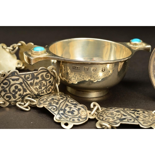 198 - A GEORGE V SILVER MINIATURE QUAICH, the handles inset with a turquoise cabochon, engraved name below... 