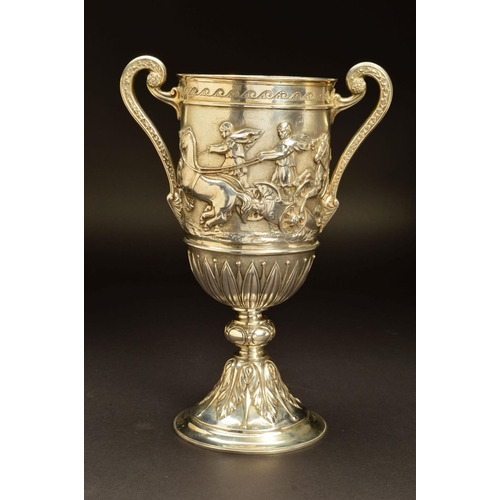 199 - A VICTORIAN SILVER TWIN HANDLED TROPHY CUP, decorated with an engraved band of rolling waves above a... 