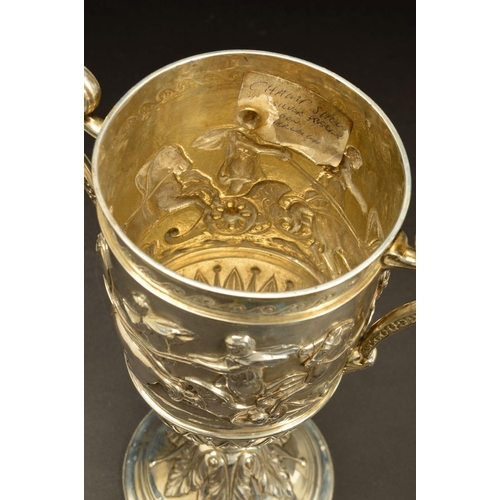 199 - A VICTORIAN SILVER TWIN HANDLED TROPHY CUP, decorated with an engraved band of rolling waves above a... 