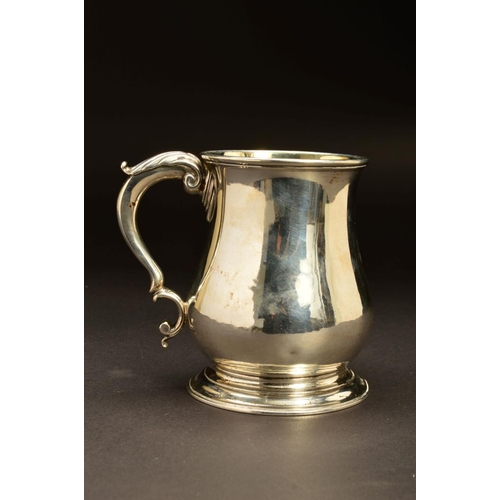 206 - A GEORGE II SILVER TANKARD, of baluster form, 'S' scroll handle with foliate thumb piece, gilt inter... 