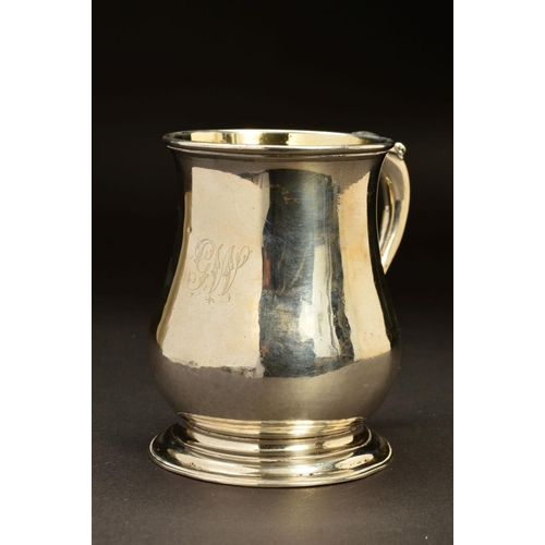 206 - A GEORGE II SILVER TANKARD, of baluster form, 'S' scroll handle with foliate thumb piece, gilt inter... 