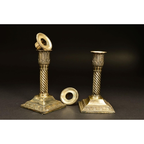 209 - A PAIR OF EDWARDIAN SILVER DWARF CANDLESTICKS, the removable sconces with beaded rims above foliate ... 