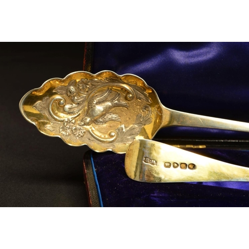 210 - A CASED PAIR OF GEORGE IV SILVER GILT BERRY SPOONS, foliate chased handles engraved with initials 'J... 