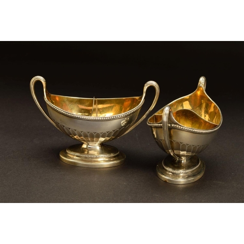 211 - A PAIR OF GEORGE III SILVER DIVIDED TWIN HANDLED SALTS, of oval form, beaded rims, gilt interiors, p... 