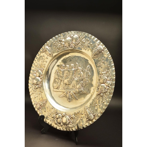 215 - A LATE 19TH/EARLY 20TH CENTURY HANAU SILVER CHARGER, crimped rim, the border embossed with alternati... 