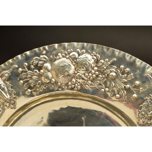 215 - A LATE 19TH/EARLY 20TH CENTURY HANAU SILVER CHARGER, crimped rim, the border embossed with alternati... 