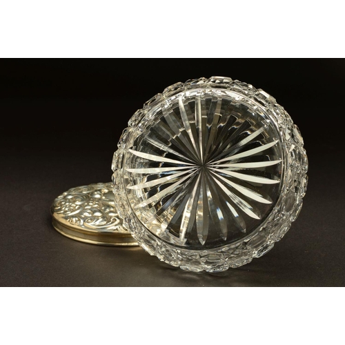 223 - AN ELIZABETH II SILVER TOPPED GLASS DRESSING TABLE/POWDER BOWL, of circular form, foliate repousse d... 