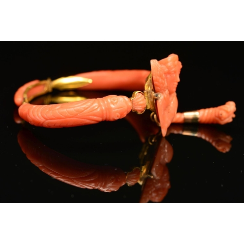 23 - A DELICATE VICTORIAN CARVED CORAL BANGLE, centring on a carved cameo depicting Demeter, suspending a... 