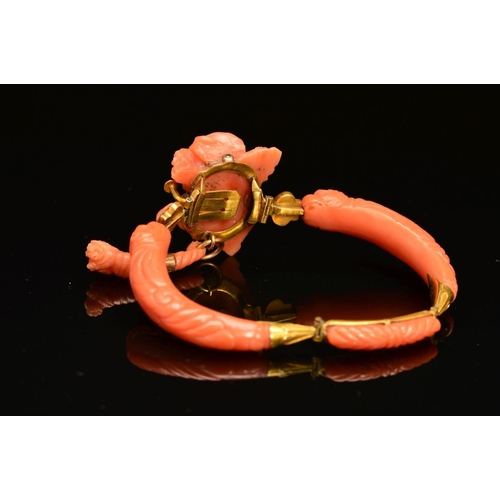 23 - A DELICATE VICTORIAN CARVED CORAL BANGLE, centring on a carved cameo depicting Demeter, suspending a... 