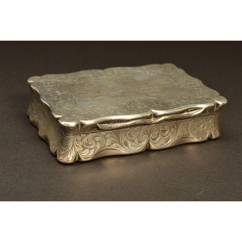 232 - A VICTORIAN SILVER SNUFF BOX, of shaped rectangular form, foliate engraved decoration throughout wit... 