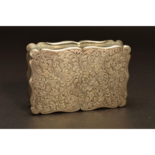 232 - A VICTORIAN SILVER SNUFF BOX, of shaped rectangular form, foliate engraved decoration throughout wit... 