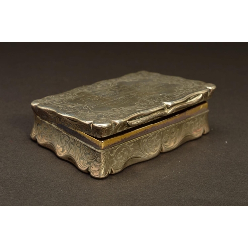 232 - A VICTORIAN SILVER SNUFF BOX, of shaped rectangular form, foliate engraved decoration throughout wit... 