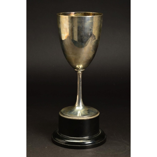 234 - A GEORGE V SILVER TROPHY CUP, plain with beaded foot rim, mounted on a black plastic socle base, mak... 