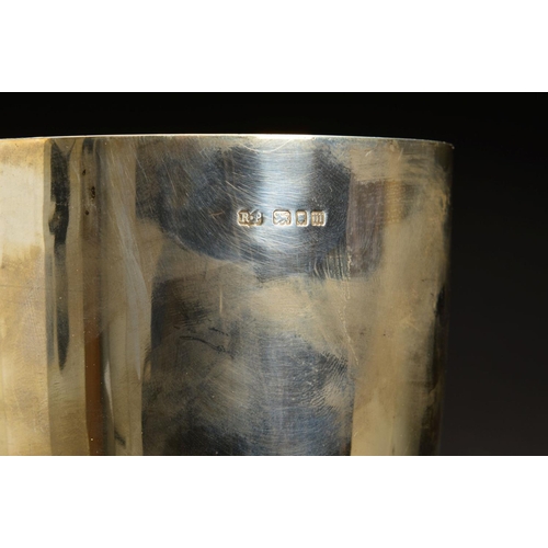 235 - A GEORGE V SILVER TROPHY CUP, plain with knopped stem, mounted on a black plastic socle base, makers... 