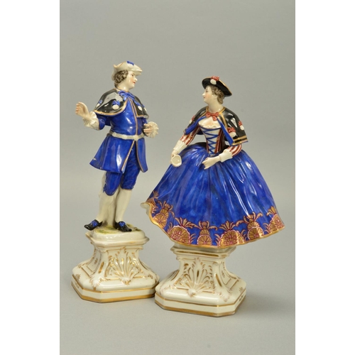 243 - A PAIR OF LATE 18TH/EARLY 19TH CENTURY GERMAN PORCELAIN FIGURES OF A LADY AND GENTLEMAN, both wearin... 