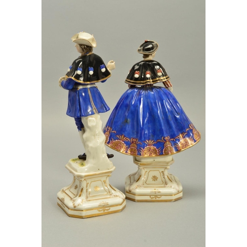 243 - A PAIR OF LATE 18TH/EARLY 19TH CENTURY GERMAN PORCELAIN FIGURES OF A LADY AND GENTLEMAN, both wearin... 