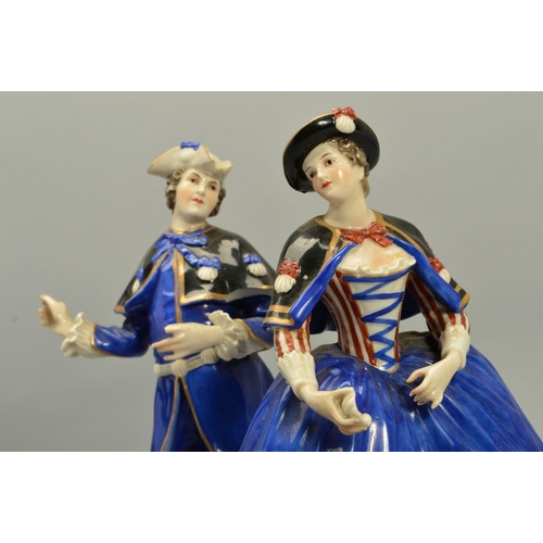 243 - A PAIR OF LATE 18TH/EARLY 19TH CENTURY GERMAN PORCELAIN FIGURES OF A LADY AND GENTLEMAN, both wearin... 