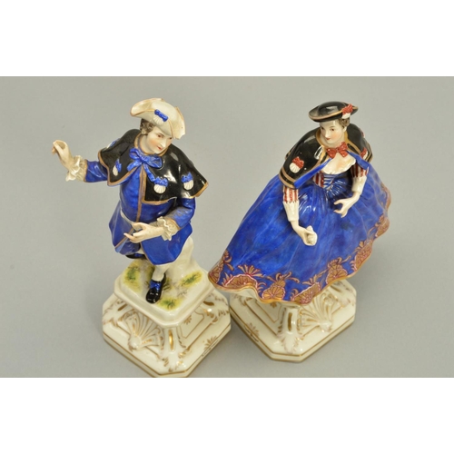 243 - A PAIR OF LATE 18TH/EARLY 19TH CENTURY GERMAN PORCELAIN FIGURES OF A LADY AND GENTLEMAN, both wearin... 