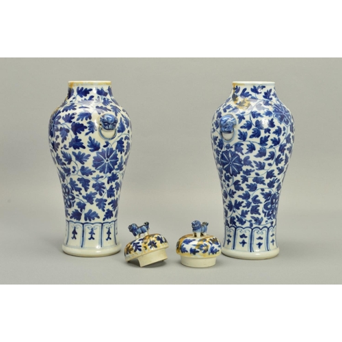 250 - A PAIR OF CHINESE PORCELAIN BALUSTER VASES AND COVERS, decorated in underglaze blue with trailing fo... 