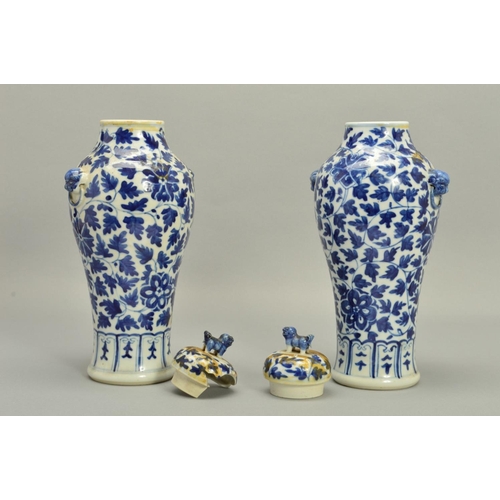 250 - A PAIR OF CHINESE PORCELAIN BALUSTER VASES AND COVERS, decorated in underglaze blue with trailing fo... 