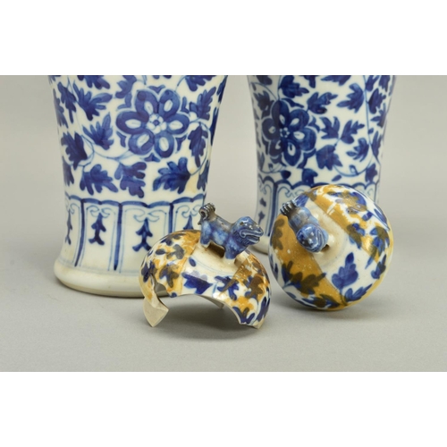 250 - A PAIR OF CHINESE PORCELAIN BALUSTER VASES AND COVERS, decorated in underglaze blue with trailing fo... 