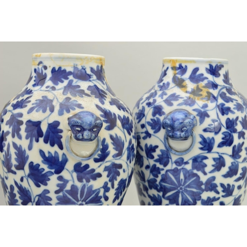 250 - A PAIR OF CHINESE PORCELAIN BALUSTER VASES AND COVERS, decorated in underglaze blue with trailing fo... 