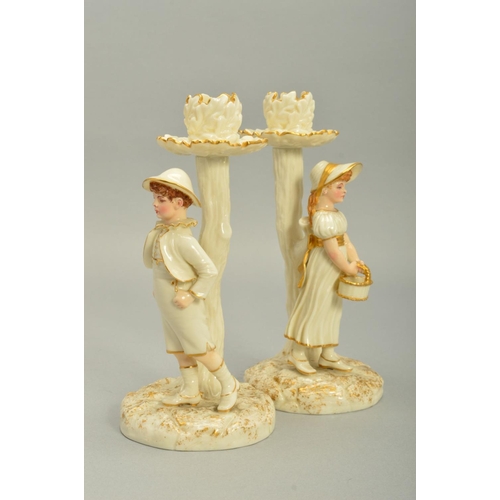 252 - A PAIR OF ROYAL WORCESTER KATE GREENWAY STYLE FIGURAL CANDLESTICKS, modelled by James Hadley, white ... 