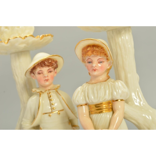 252 - A PAIR OF ROYAL WORCESTER KATE GREENWAY STYLE FIGURAL CANDLESTICKS, modelled by James Hadley, white ... 