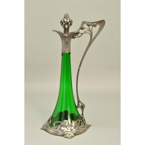 257 - AN ART NOUVEAU WMF (ATTRIBUTED) CLARET JUG, the conical green glass body with openwork stopper and h... 